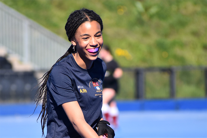 female hockey player happy